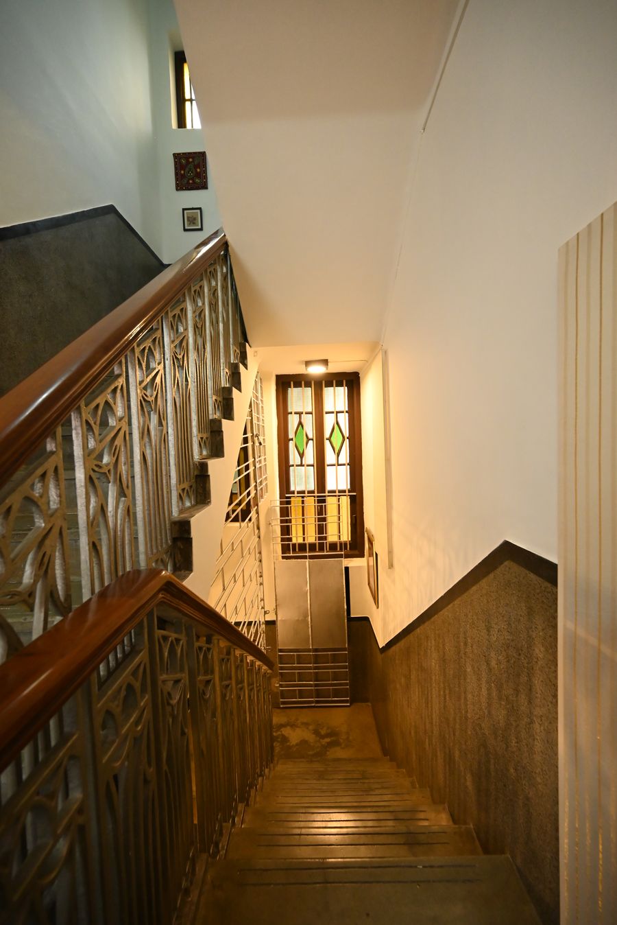 Heritage corridor with ornate metal railing